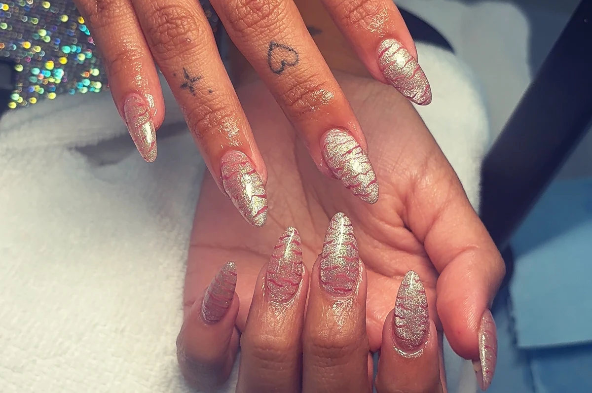 Carlita’s original nail work: pink + gold striped shimmer