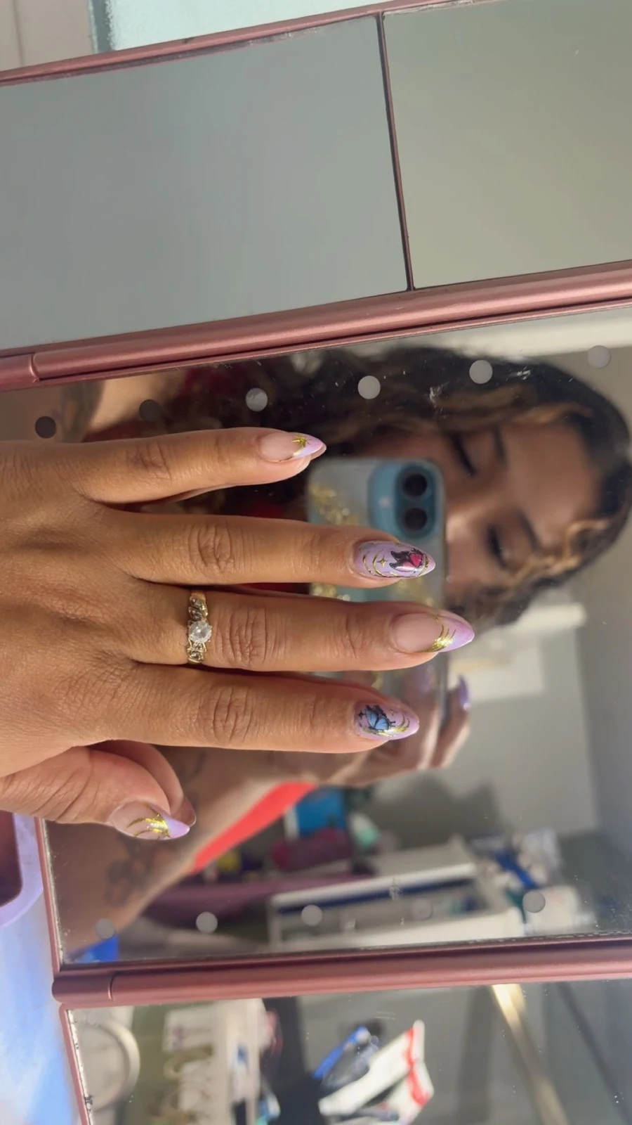 Carlita’s original nail work: lilac + gold butterflies