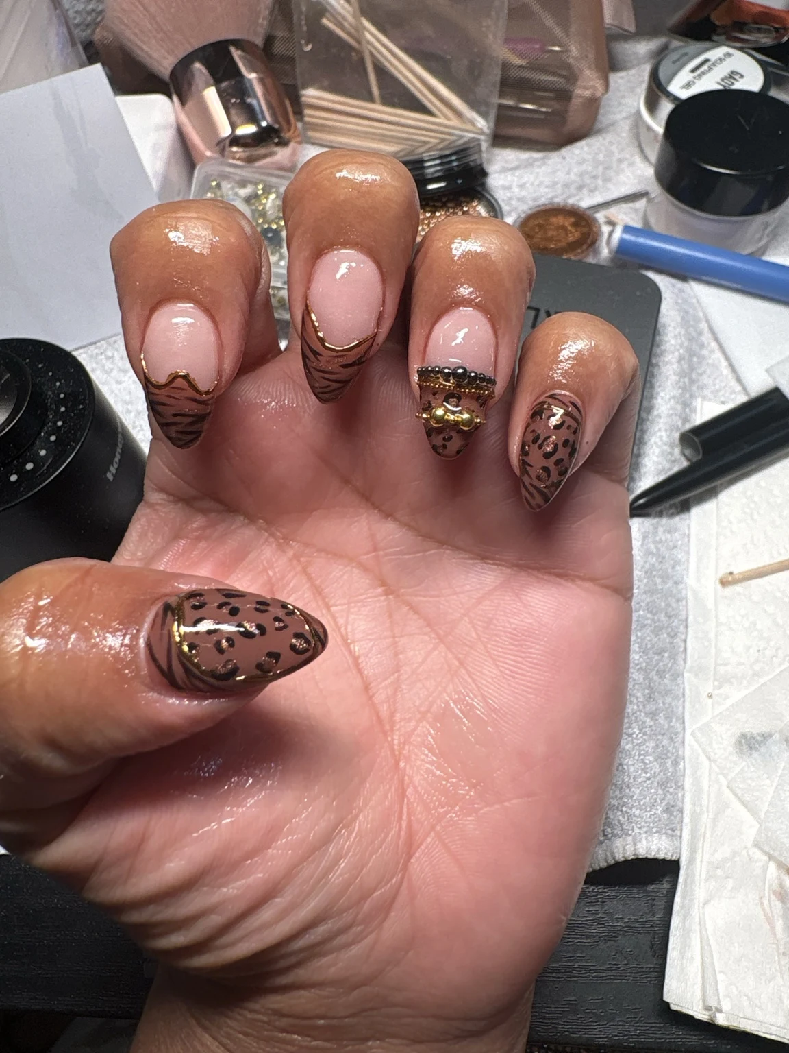 Carlita’s original nail work: animal print + gold