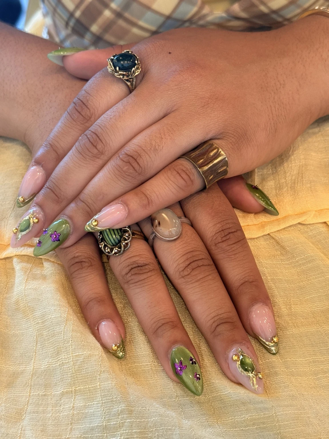 Carlita’s original nail work: green + gold details